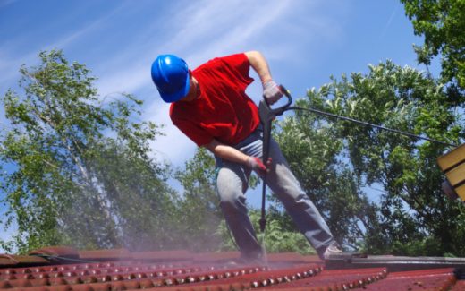 House roof cleaning with pressure tool